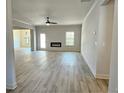 Spacious living room with LVP flooring, fireplace, and ceiling fan at 168 Silvercrest Dr, Acworth, GA 30101