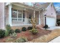 Inviting front porch with brick columns and landscaping at 2024 Gramercy Cir, Atlanta, GA 30341