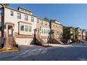 Row of townhouses with brick exteriors and attached garages at 372 Provenance Dr, Sandy Springs, GA 30328