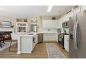 Modern kitchen with white cabinets, stainless steel appliances, and an island at 4693 Creekside Villas Se Way, Smyrna, GA 30082