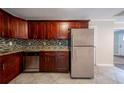 Well-designed kitchen with stainless steel appliances, tile backsplash, and stylish cabinetry at 2802 Mcafee Rd, Decatur, GA 30032