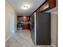 Bright kitchen features stainless steel appliances, modern cabinetry, and ceramic tile flooring at 2802 Mcafee Rd, Decatur, GA 30032