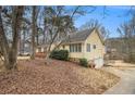 View of the home's side exterior showcasing siding, windows, and garage at 4741 W Lake Se Dr, Conyers, GA 30094