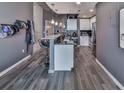 Open kitchen with granite island and stainless steel appliances at 361 17Th Nw St # 1121, Atlanta, GA 30363
