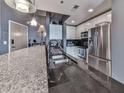 Modern kitchen with granite countertops and stainless steel appliances at 361 17Th Nw St # 1121, Atlanta, GA 30363