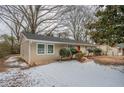 House exterior showcasing a red front door and snowy yard at 1728 W Austin Rd, Decatur, GA 30032