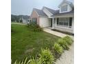 Lovely home with manicured lawn and mature landscaping at 3745 Hudson Ct, Rex, GA 30273