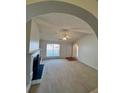 Inviting living room with a fireplace and archways, providing a cozy and stylish atmosphere at 3745 Hudson Ct, Rex, GA 30273