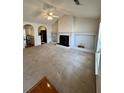 Spacious living room features a ceiling fan, neutral carpeting, and a fireplace with built-ins at 3745 Hudson Ct, Rex, GA 30273