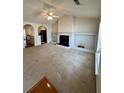 Spacious living room with a decorative fireplace, large vaulted ceiling, and carpeted flooring at 3745 Hudson Ct, Rex, GA 30273