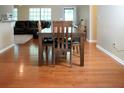 Dining room with hardwood floors and table for six at 3870 N Shelby N Ln, Douglasville, GA 30135