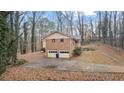 Two-car garage with a wide driveway at 3870 N Shelby N Ln, Douglasville, GA 30135