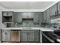 Modern kitchen with gray cabinets, quartz counters at 3344 Northcrest Rd # A, Atlanta, GA 30340
