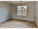 Spacious bedroom with light walls and wood-look flooring at 4668 Snap Creek Ln, Decatur, GA 30035