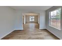 Open dining room with wood-look floors and views to the kitchen at 4668 Snap Creek Ln, Decatur, GA 30035