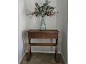 Entryway table with eucalyptus arrangement and rustic charm at 1507 Wynnes Ridge Se Cir, Marietta, GA 30067