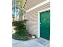 Inviting green front door with decorative wreath and 'Home Sweet Home' welcome mat at 1507 Wynnes Ridge Se Cir, Marietta, GA 30067