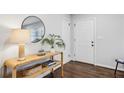 Bright and airy entryway with console table, mirror, and hardwood floors at 1682 Valencia Rd, Decatur, GA 30032