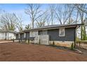 Ranch home features gray brick, updated landscaping, and a modern front door at 1682 Valencia Rd, Decatur, GA 30032