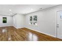 Hardwood floors and neutral walls in this spacious living room at 1709 Valencia Rd, Decatur, GA 30032