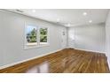 Living room with hardwood floors and neutral color palette at 1709 Valencia Rd, Decatur, GA 30032