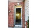 Arched brick entrance frame with view into house at 1963 White Top Rd., Lawrenceville, GA 30045