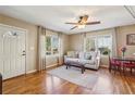 Bright living room with hardwood floors and a view of the front yard at 3001 Hilltop Dr, Atlanta, GA 30341