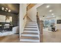 Elegant staircase with dark wood railings leading to the upper level at 754 Moon Road, Lawrenceville, GA 30046