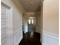 Hardwood floor hallway with access to Gathering and living rooms at 3535 Clarecastle Dr, Buford, GA 30519