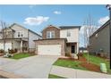 Two-story home with attached garage, front yard and landscaping at 2540 Canning View Ave, Lawrenceville, GA 30044