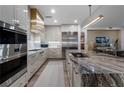 State-of-the-art kitchen with stainless steel appliances and marble island at 2520 Peachtree Nw Rd # 1202, Atlanta, GA 30305