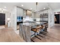Open concept kitchen with a large marble island and stainless steel appliances at 2520 Peachtree Nw Rd # 1202, Atlanta, GA 30305