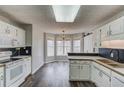 Bright kitchen featuring a breakfast nook, stainless appliances, dark backsplash and wooden countertops at 93 Highway 81, Oxford, GA 30054
