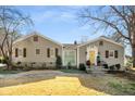 Charming home featuring symmetrical design, neutral siding, manicured landscaping and inviting front entrance at 3495 Habersham Nw Rd, Atlanta, GA 30305