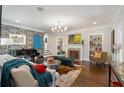 Elegant living room with a fireplace, hardwood floors, and stylish decor at 3495 Habersham Nw Rd, Atlanta, GA 30305