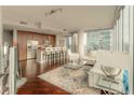 Open concept living and kitchen area with hardwood floors at 1080 Peachtree Ne St # 2710, Atlanta, GA 30309