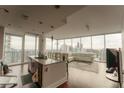 Spacious living room with city views and hardwood floors at 1080 Peachtree Ne St # 2710, Atlanta, GA 30309