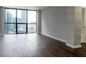 Living room with hardwood floors and city view at 1280 W Peachtree Nw St # 2813, Atlanta, GA 30309