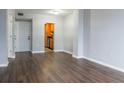 Bright living room featuring hardwood floors and kitchen access at 1280 W Peachtree Nw St # 2813, Atlanta, GA 30309