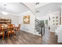 Elegant dining room with hardwood floors, a wooden table, and chair at 5402 Highland Preserve Dr, Mableton, GA 30126