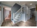 Charming entryway with hardwood floors, a staircase, and views into the dining room at 6432 Phillips Pl, Lithonia, GA 30058