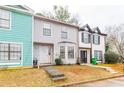 Charming townhome with tidy front lawn, concrete pathway, and well-kept exterior at 1023 Thornwoode Ln, Stone Mountain, GA 30083