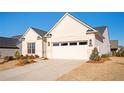 Attractive one story home with a two car garage and beautifully landscaped front yard at 412 Southbridge Pass, Peachtree City, GA 30269