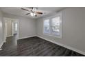 Bright living room with dark hardwood floors and ceiling fan at 1333 Womack Ave, Atlanta, GA 30344
