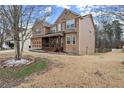 Two-story house with a three-car garage and covered porch at 6124 Locklear Way, Douglasville, GA 30134