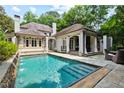 Inviting pool with spacious patio and adjacent outdoor entertaining area at 2522 Habersham Nw Rd, Atlanta, GA 30305