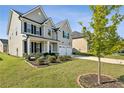 Landscaped front yard with manicured lawn and shrubs at 13136 Vista Ln, Covington, GA 30014