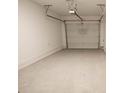 Spacious one car garage with freshly painted walls; ready for vehicles and storage at 534 Sawnee Village Blvd # D65, Cumming, GA 30040