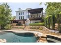 Inviting pool and spa area with a stone patio at 1211 Grand View Se Dr, Mableton, GA 30126