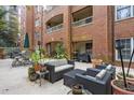 Comfortable outdoor seating on a patio with potted plants, offering a relaxing ambiance at 211 Colonial Homes Nw Dr # 1105, Atlanta, GA 30309